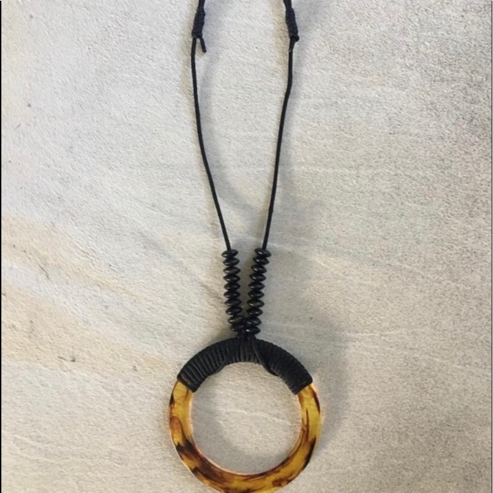 XL parachute cord necklace with amber colored 6 in diameter ring & wood beads.